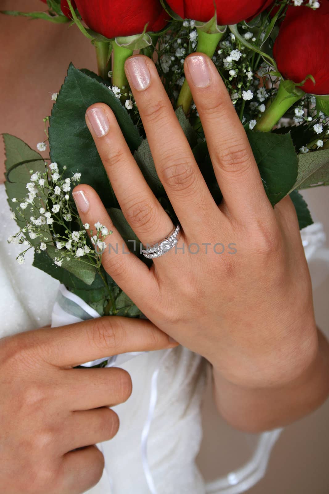Bride holding a red rose bridal bouquet
