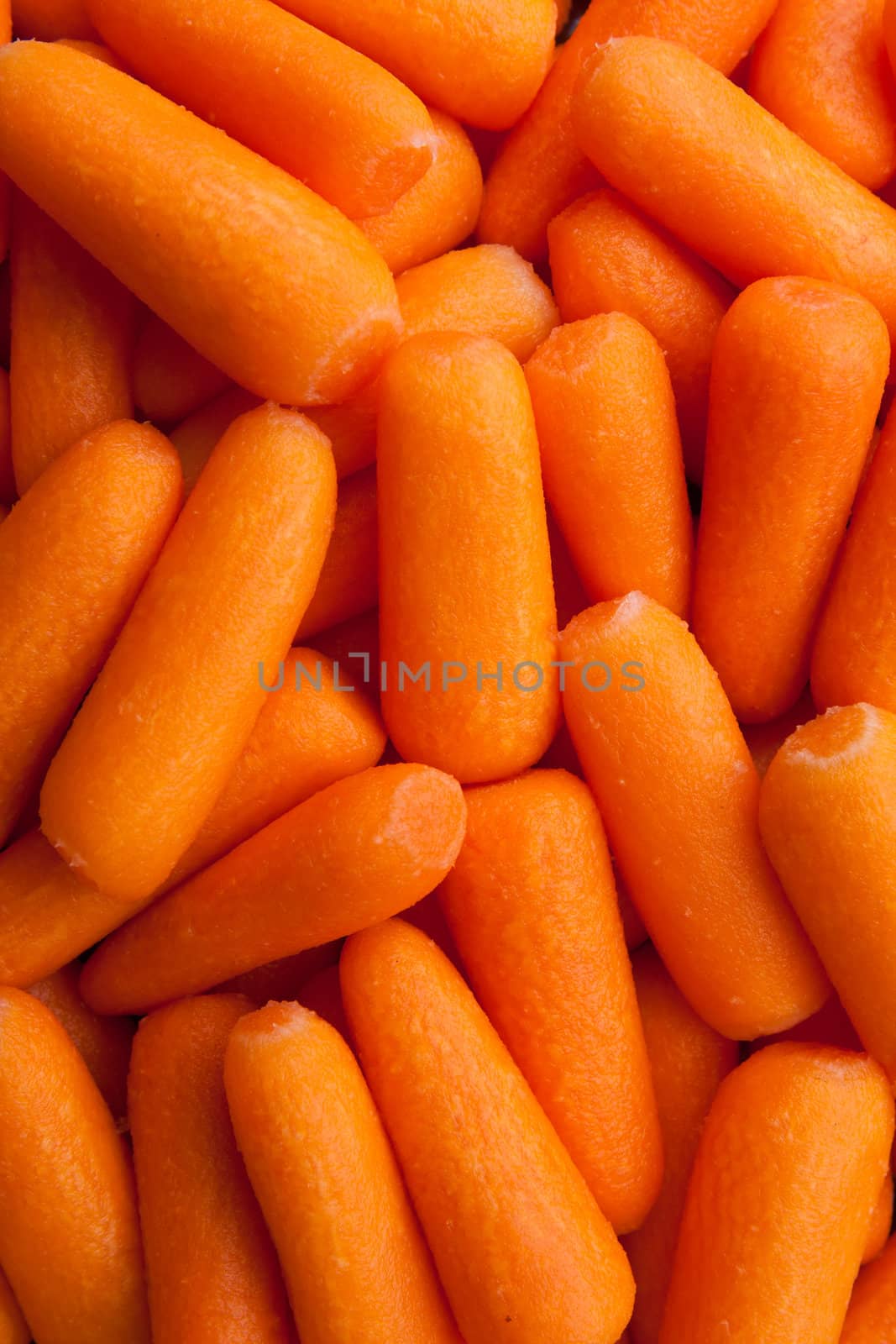 Background of raw peeled baby carrots