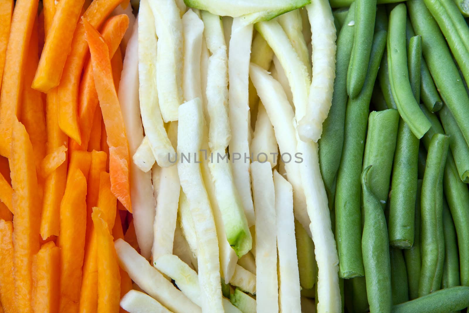 Background of julienne vegetables:  green beans, baby marrows and carrots