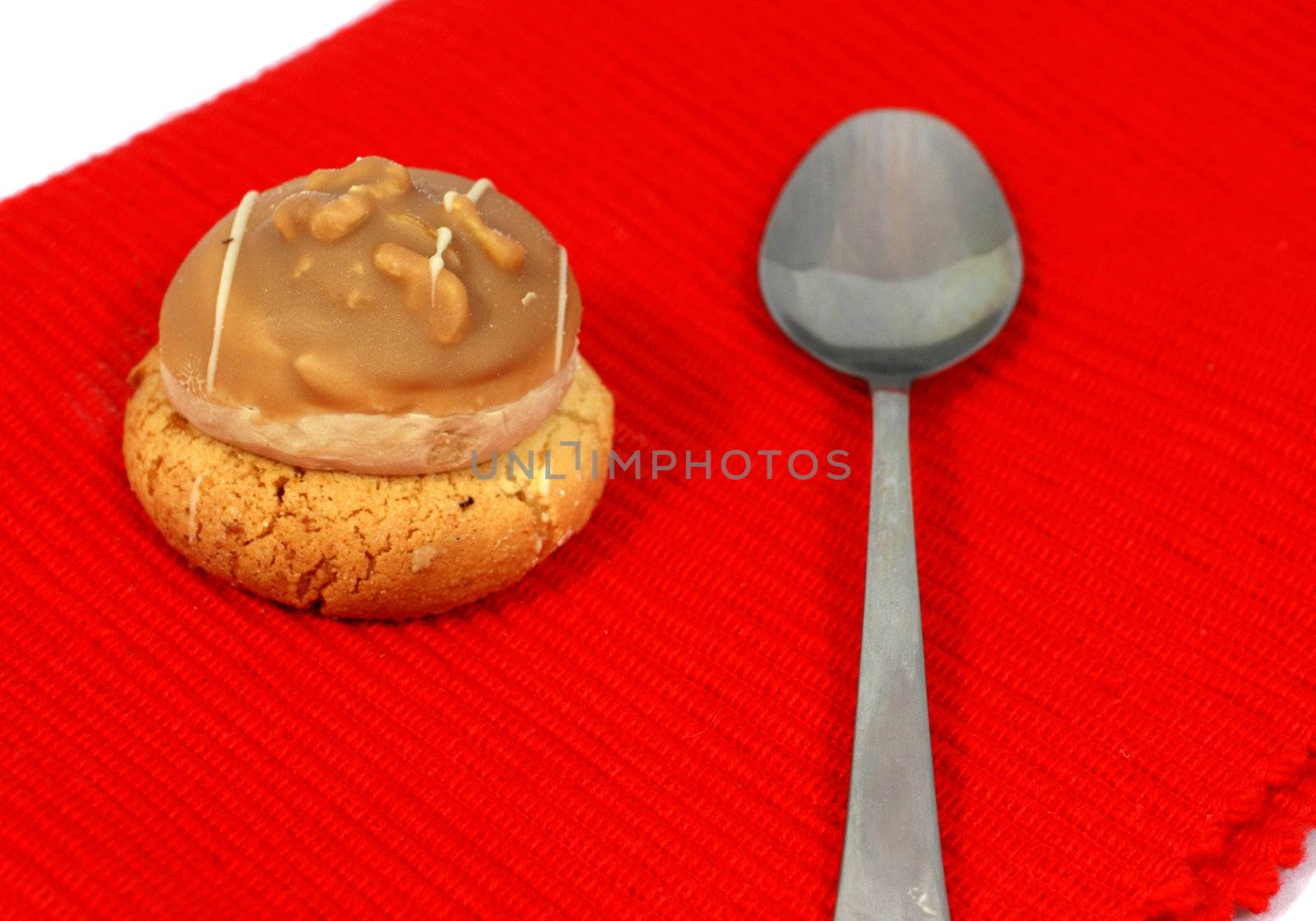 sweet dessert with spoon on red by catolla