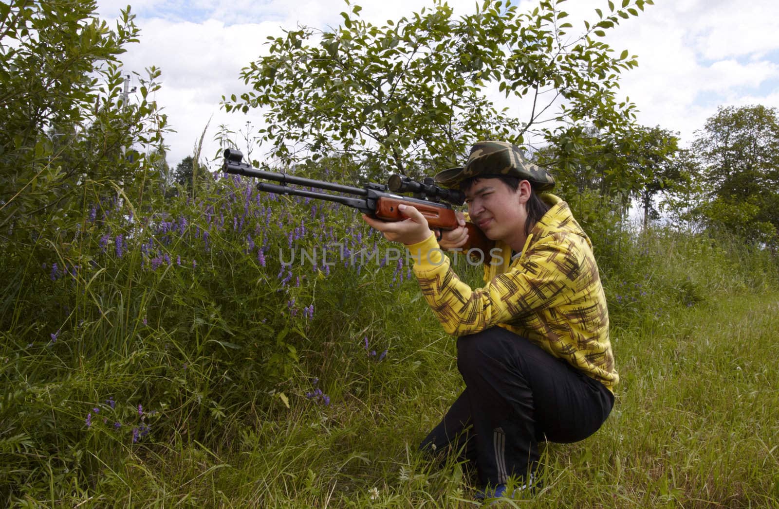 Young hunter shooting up