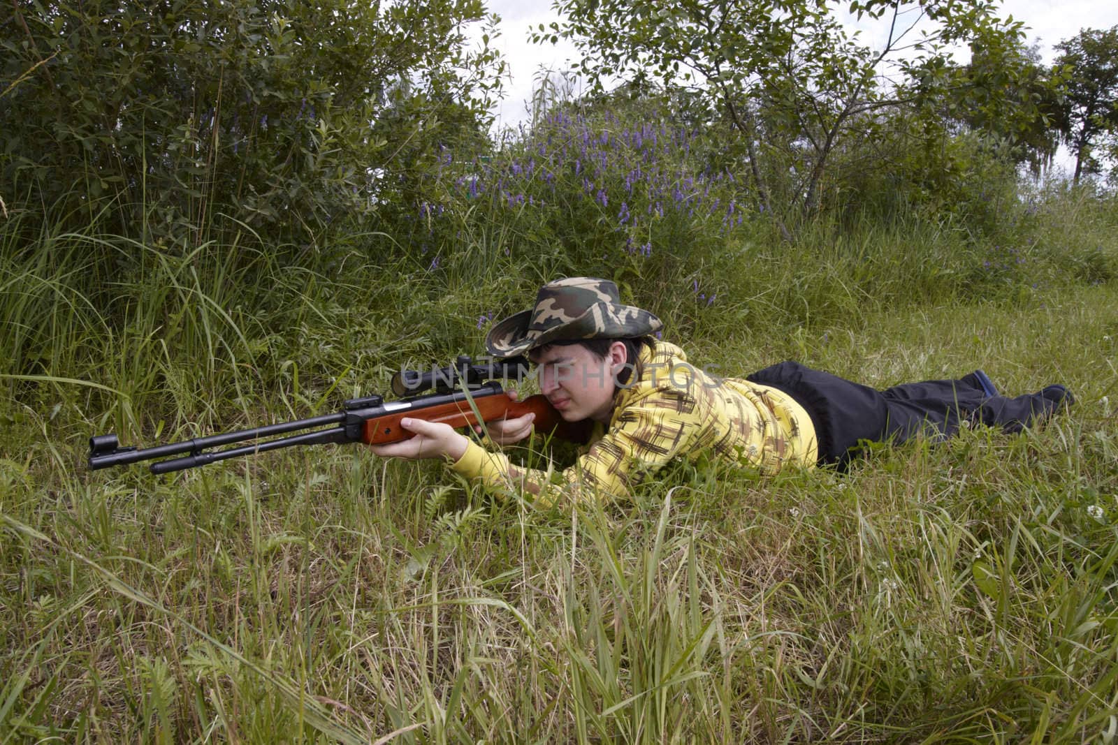 Young hunter shooting up