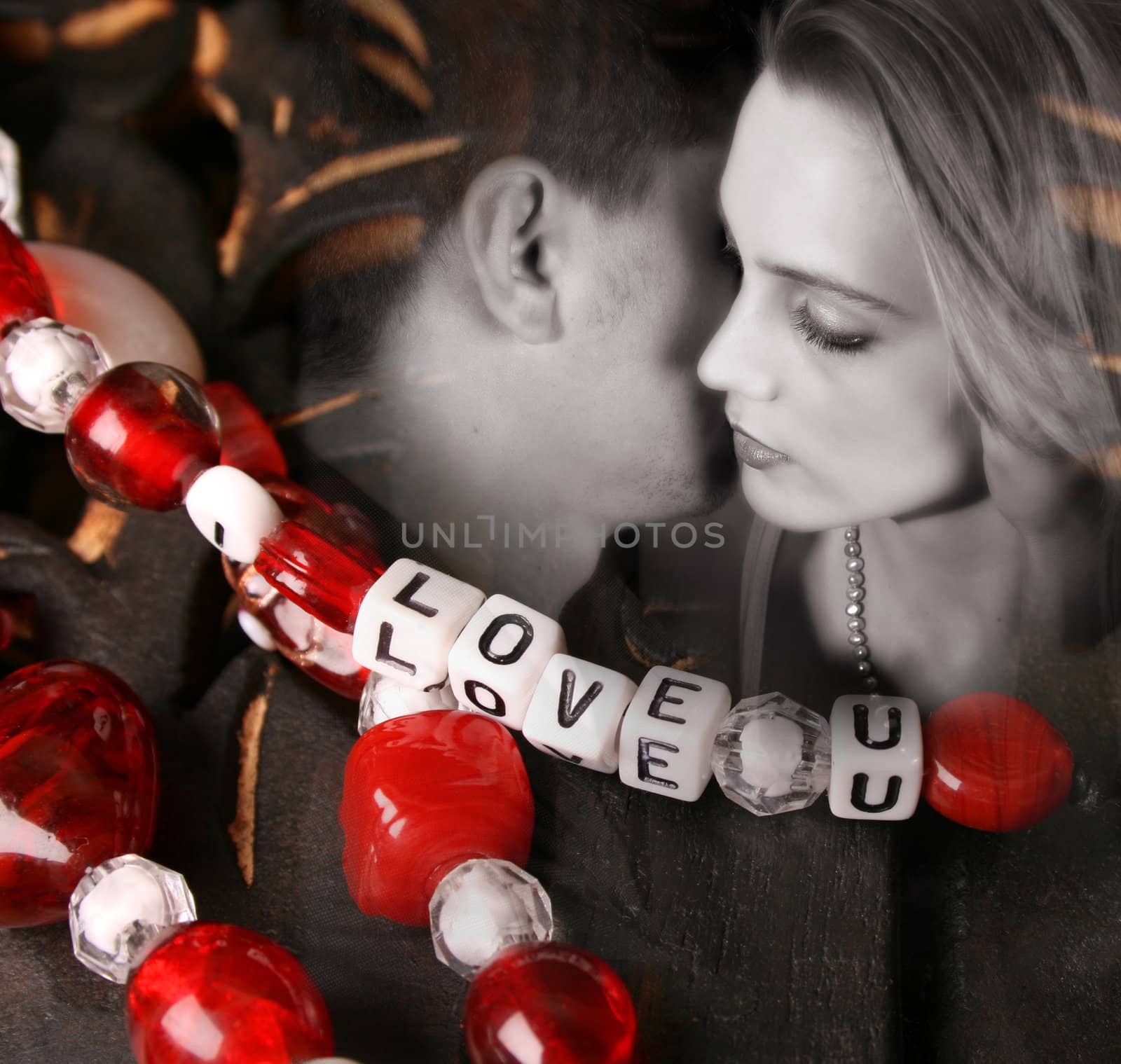 Valentines beads with letters with a Young couple in love.