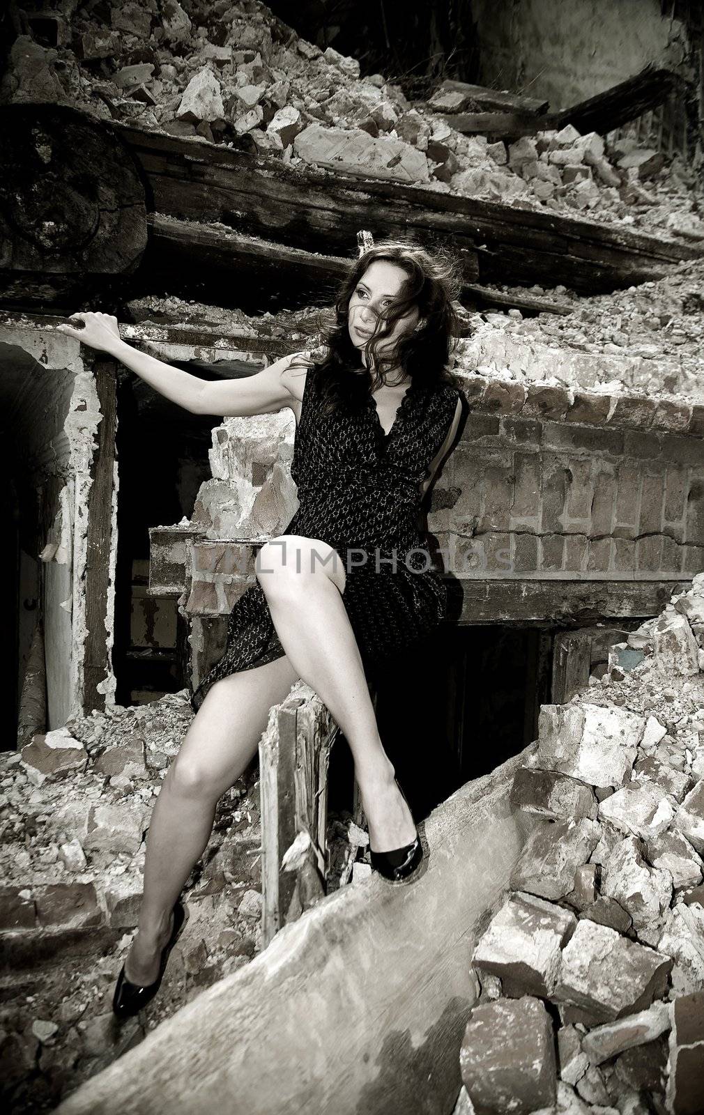 Artistic picture of sexy young woman in ruins