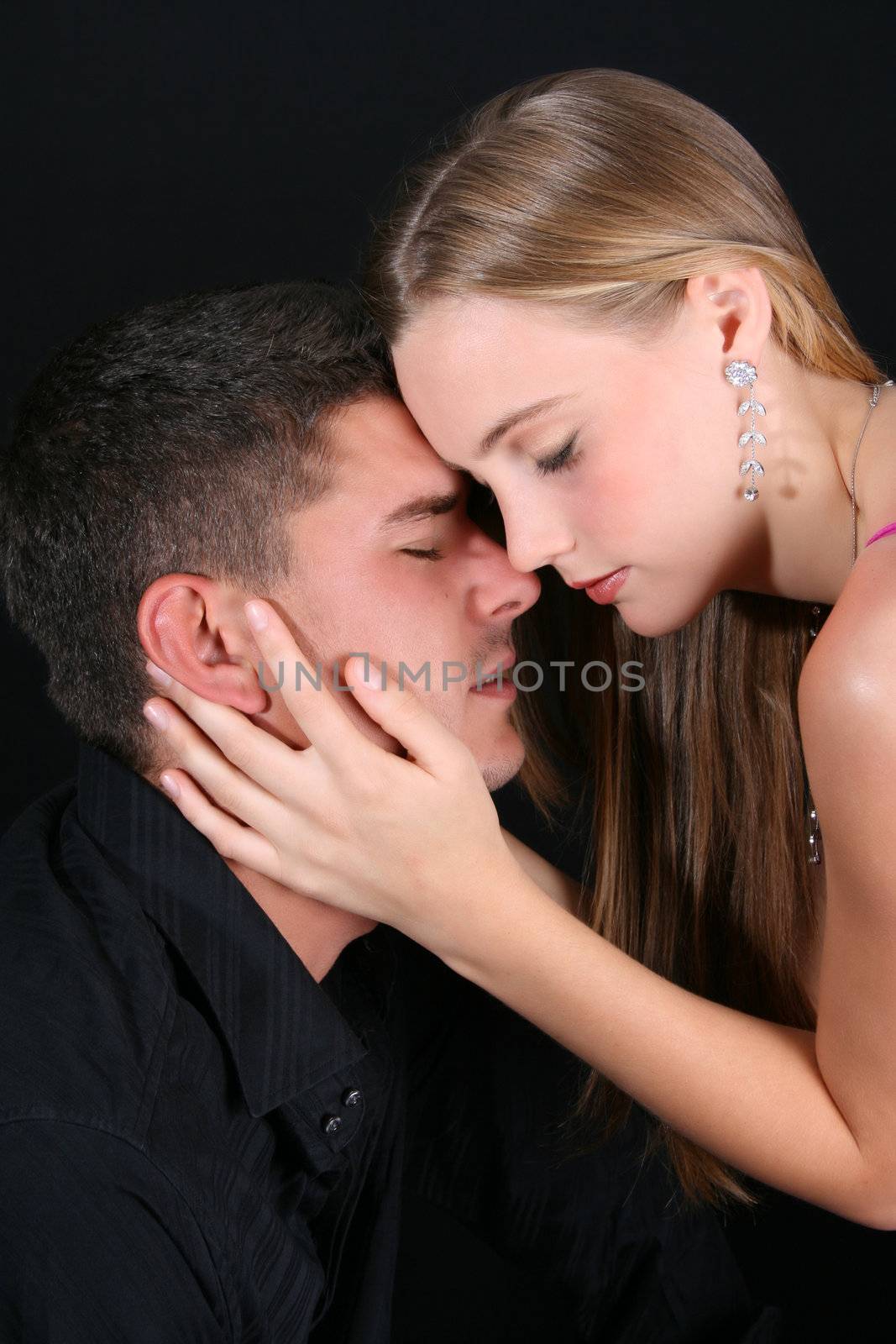 Young couple in love, faces close to one another