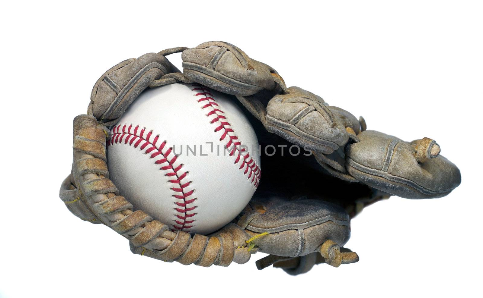 View of a hardball in the end of a baseball mitt