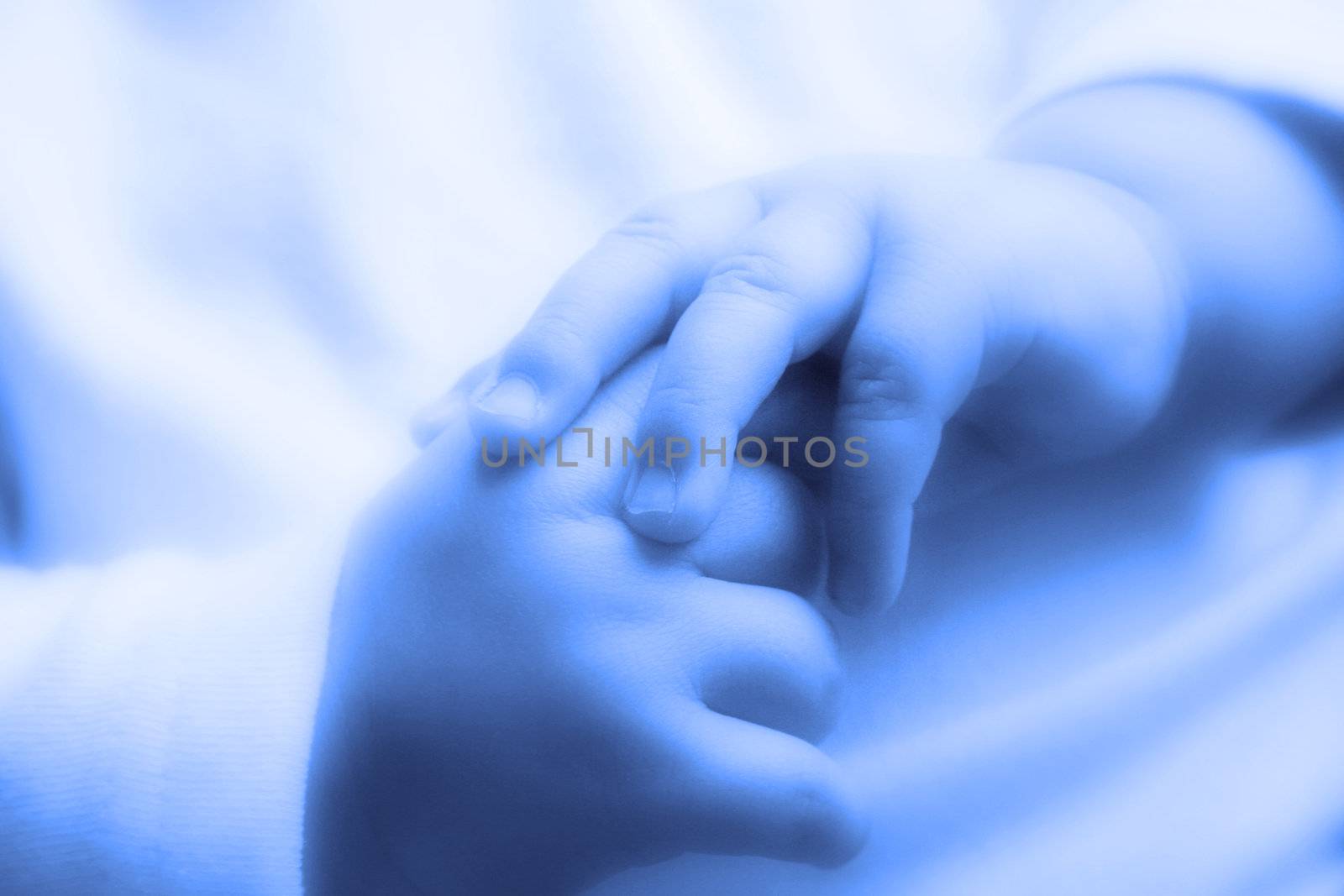 Beautiful little hands of the sleeping baby