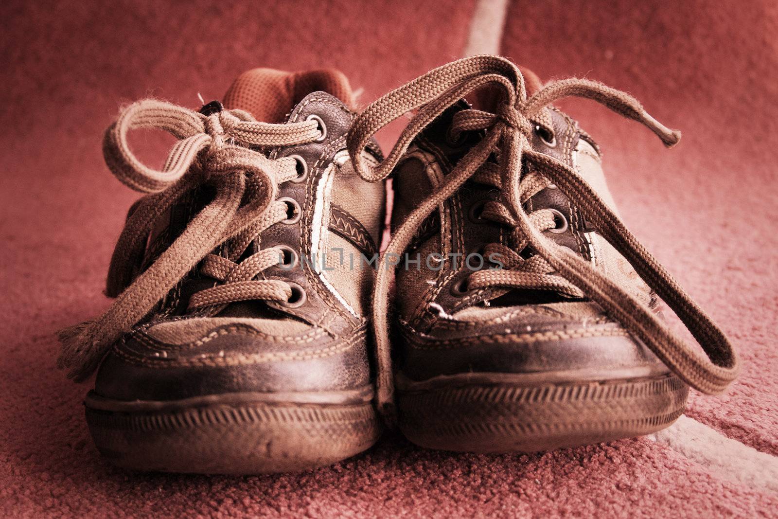 Beautiful old sport shoes of a little boy