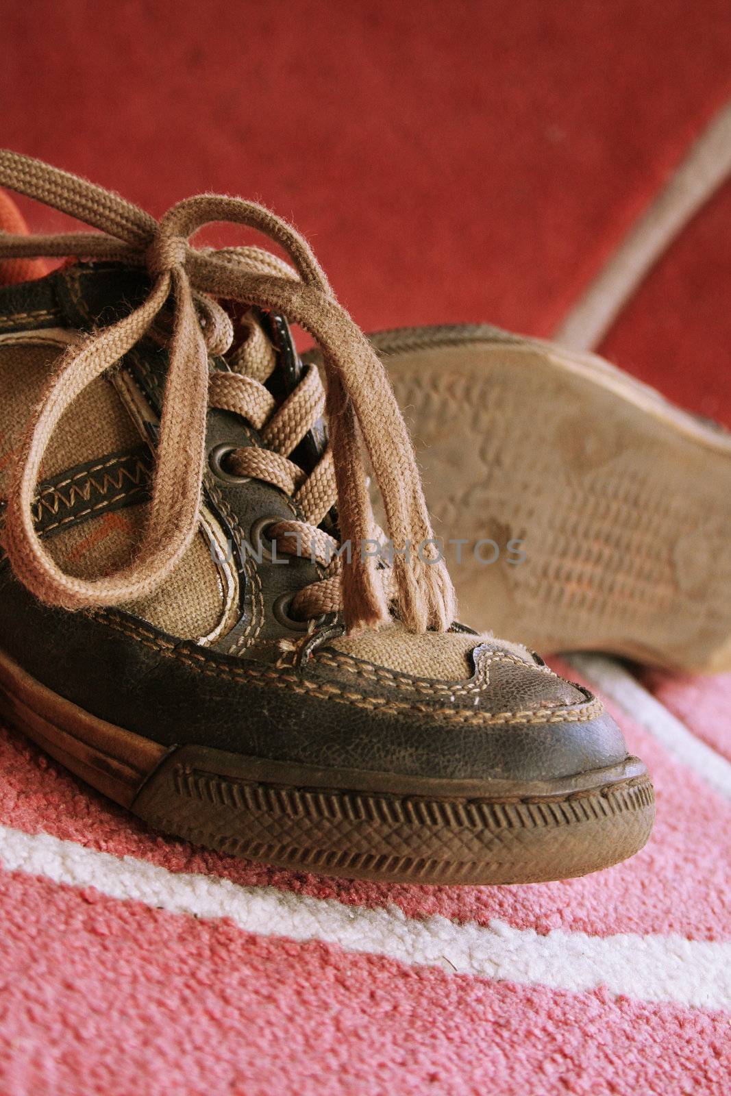 Beautiful old sport shoes of a little boy