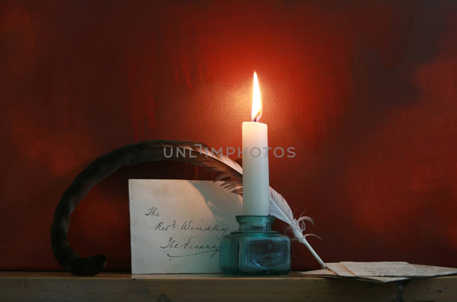 A Period set up of a feathered quill and hand written letter with envelope, set on a wooden mantle piece against a 'grunge' styled oil painted background. All elements recreated by myselfas the artist.