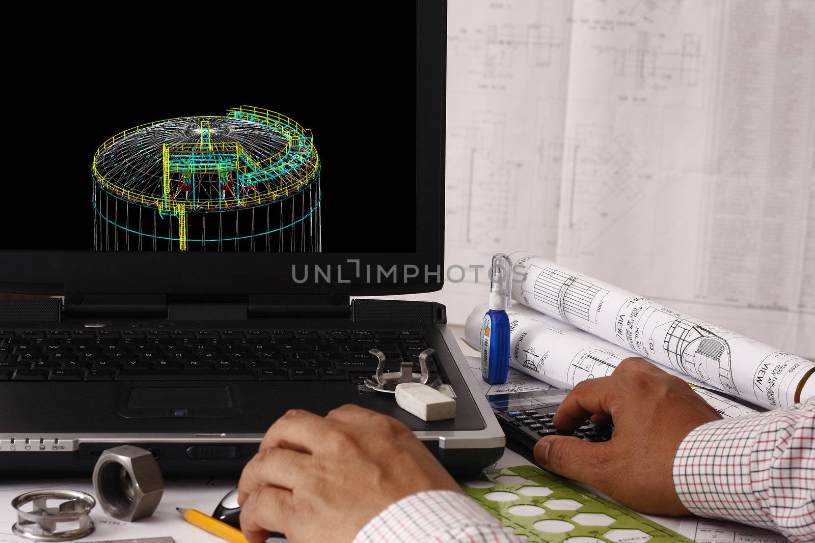 Engineer doing a 3d model review in his tank design - many uses in oil & gas industry.