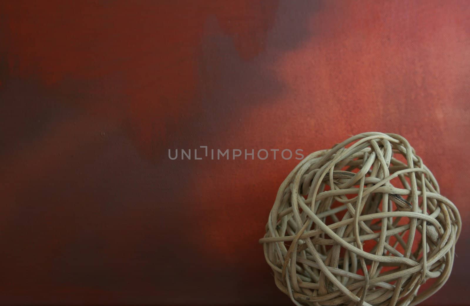 A hand made twig circular decoration set to the right hand side of a landscape format image, against a grunge styled backdrop.