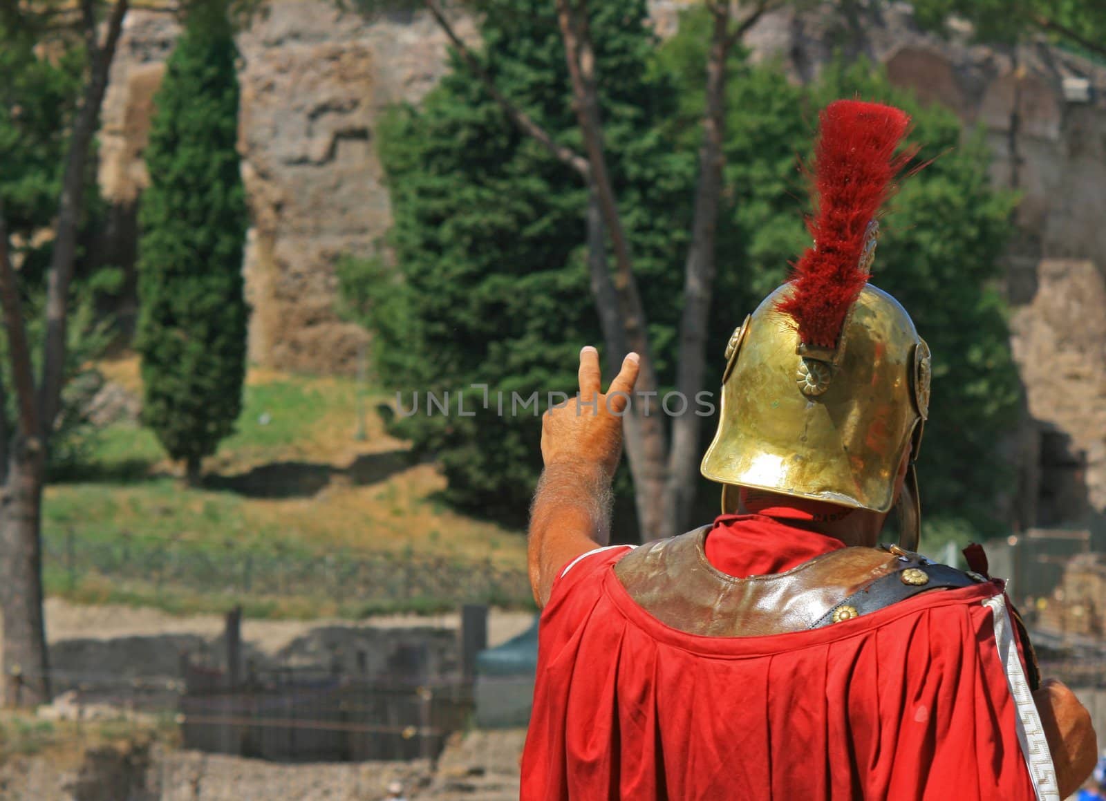 Roman soldier outside the Colosseo,Rome Italy. Taking money to pose with tourists outside the Colosseo.