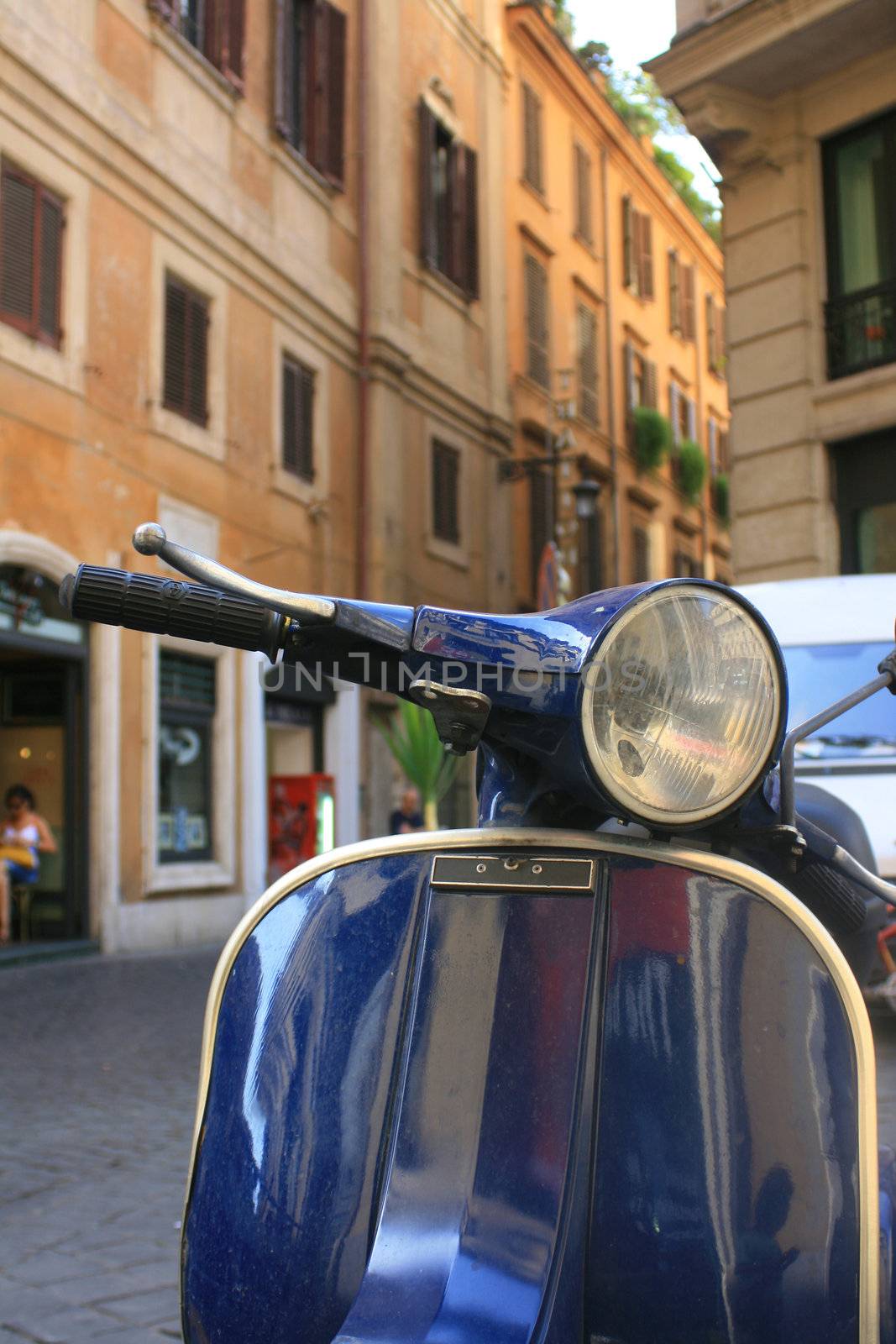 An Italian scooter in the city of Rome.