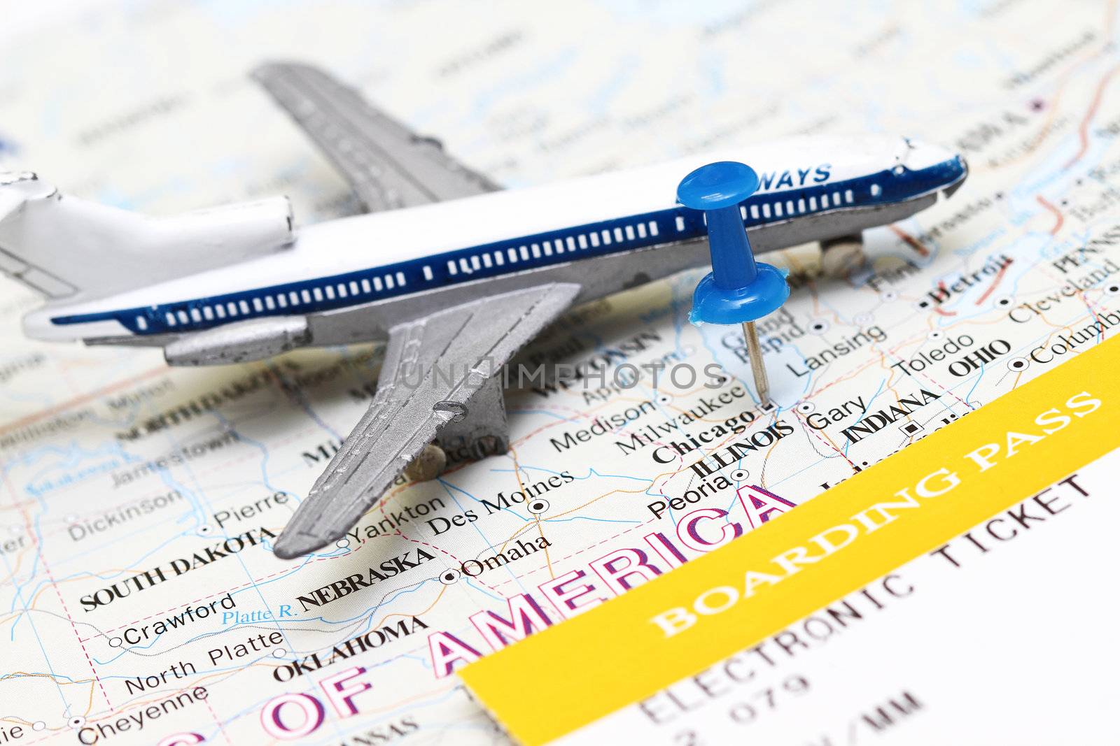 Trip to USA concept - with boarding pass and toy airplane.