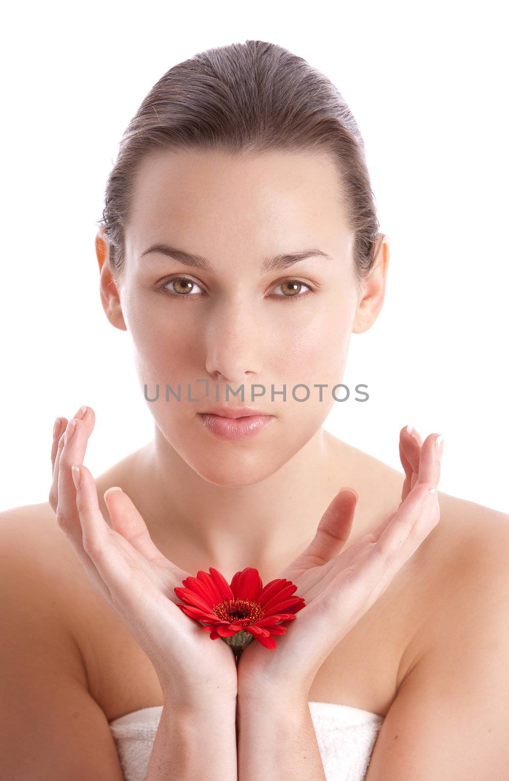 Natural beauty with red flower in her hands on white background