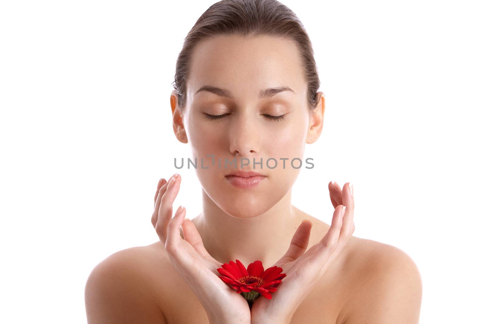 Beautiful woman with flower in her hands on white background