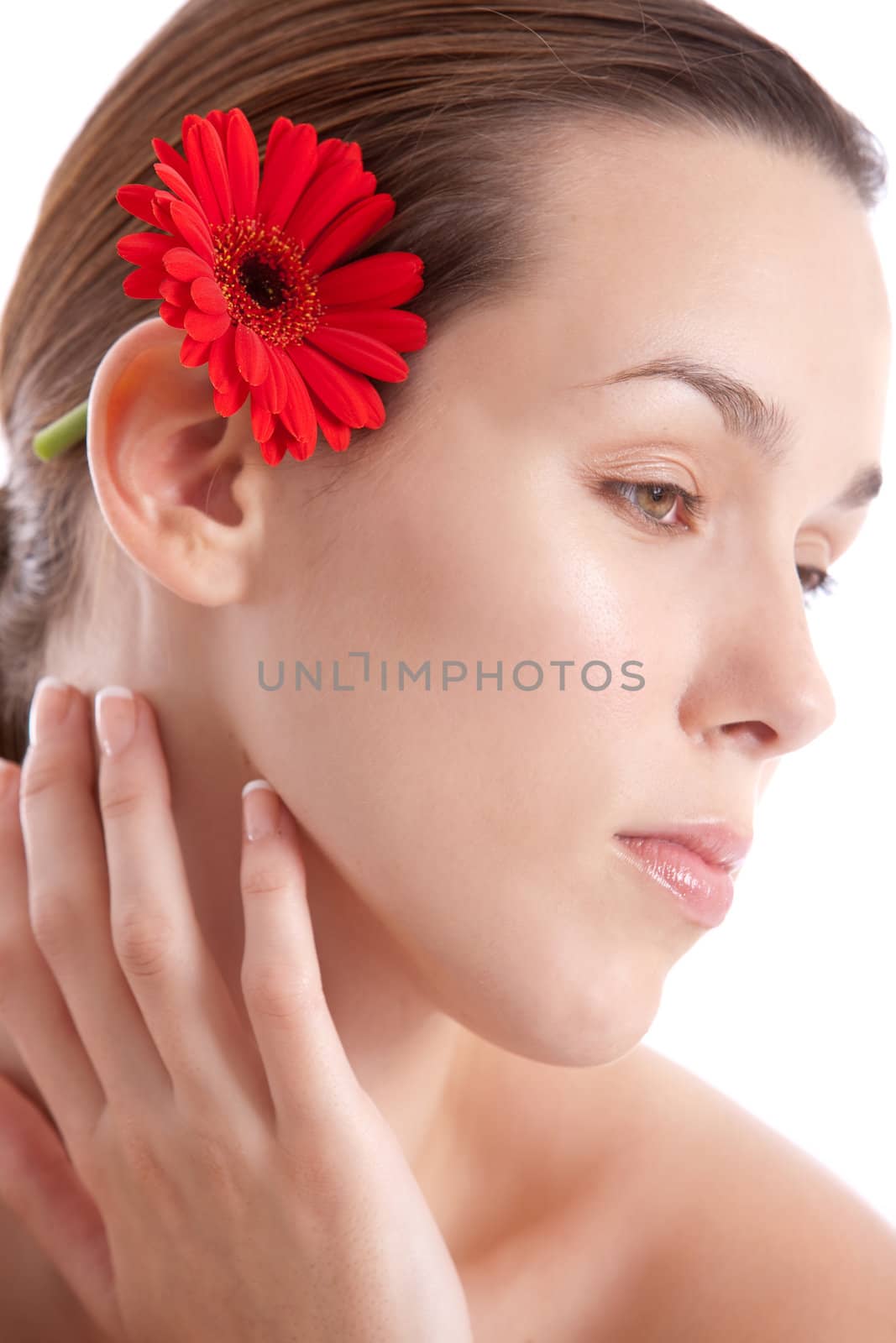 Beautiful woman with red flower in her hair