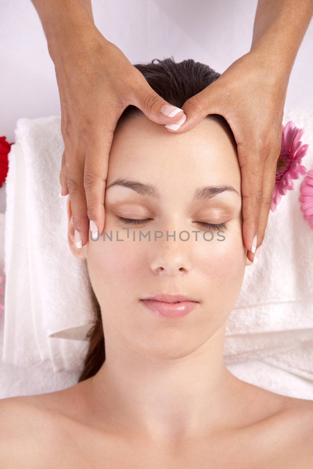 Beautiful brunette getting a massage of her head