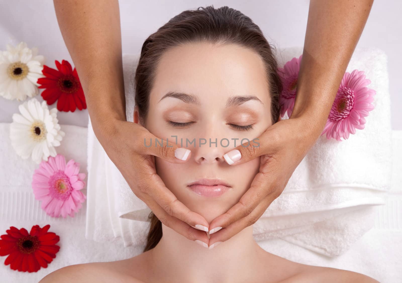 Beautiful woman receiving a spa treatment in a salon