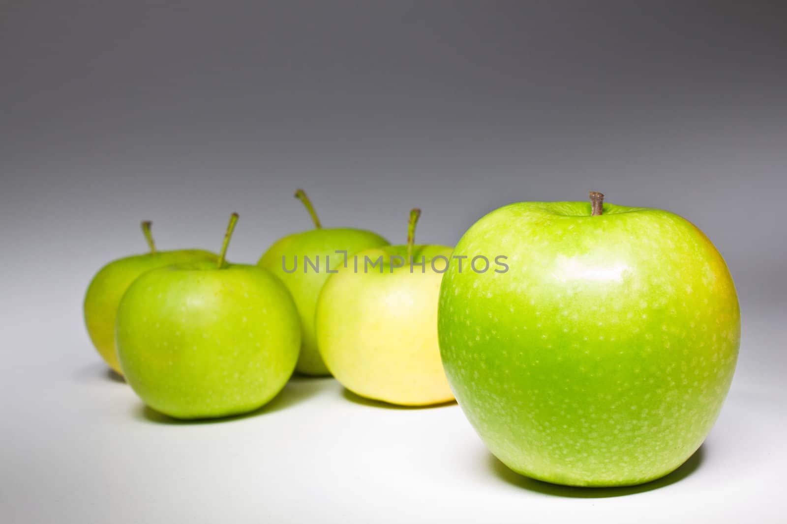 Several fresh green apples isolated on white