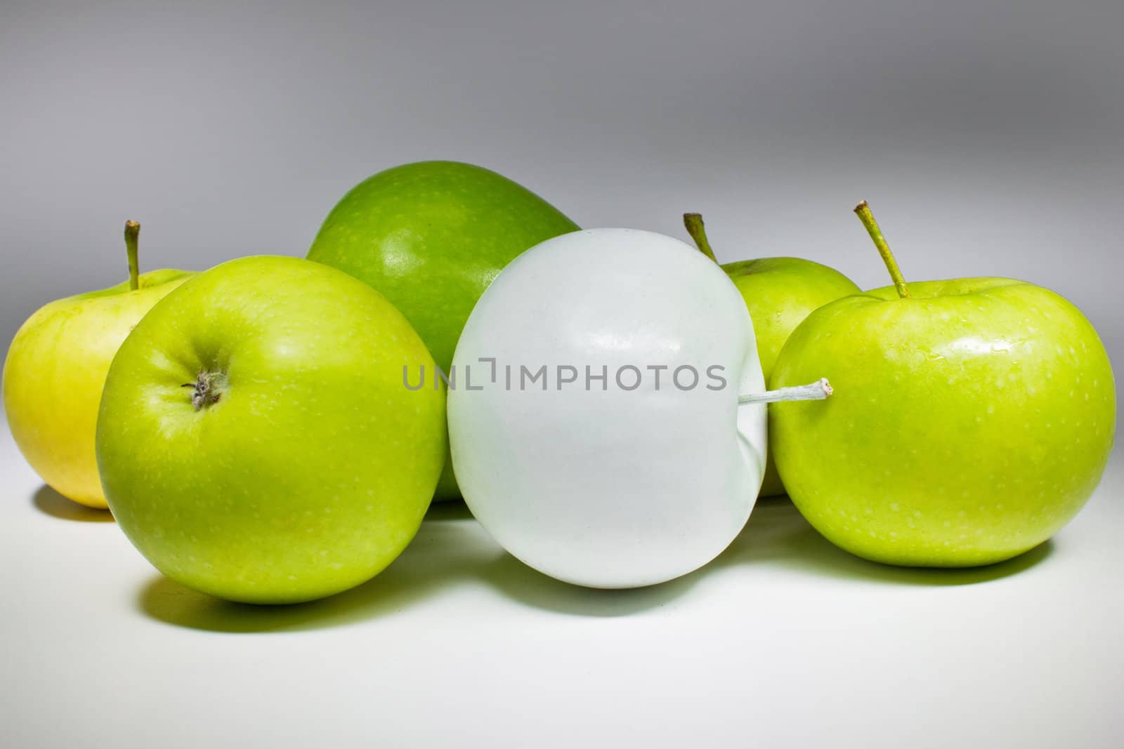 Green and white apples isolated on white