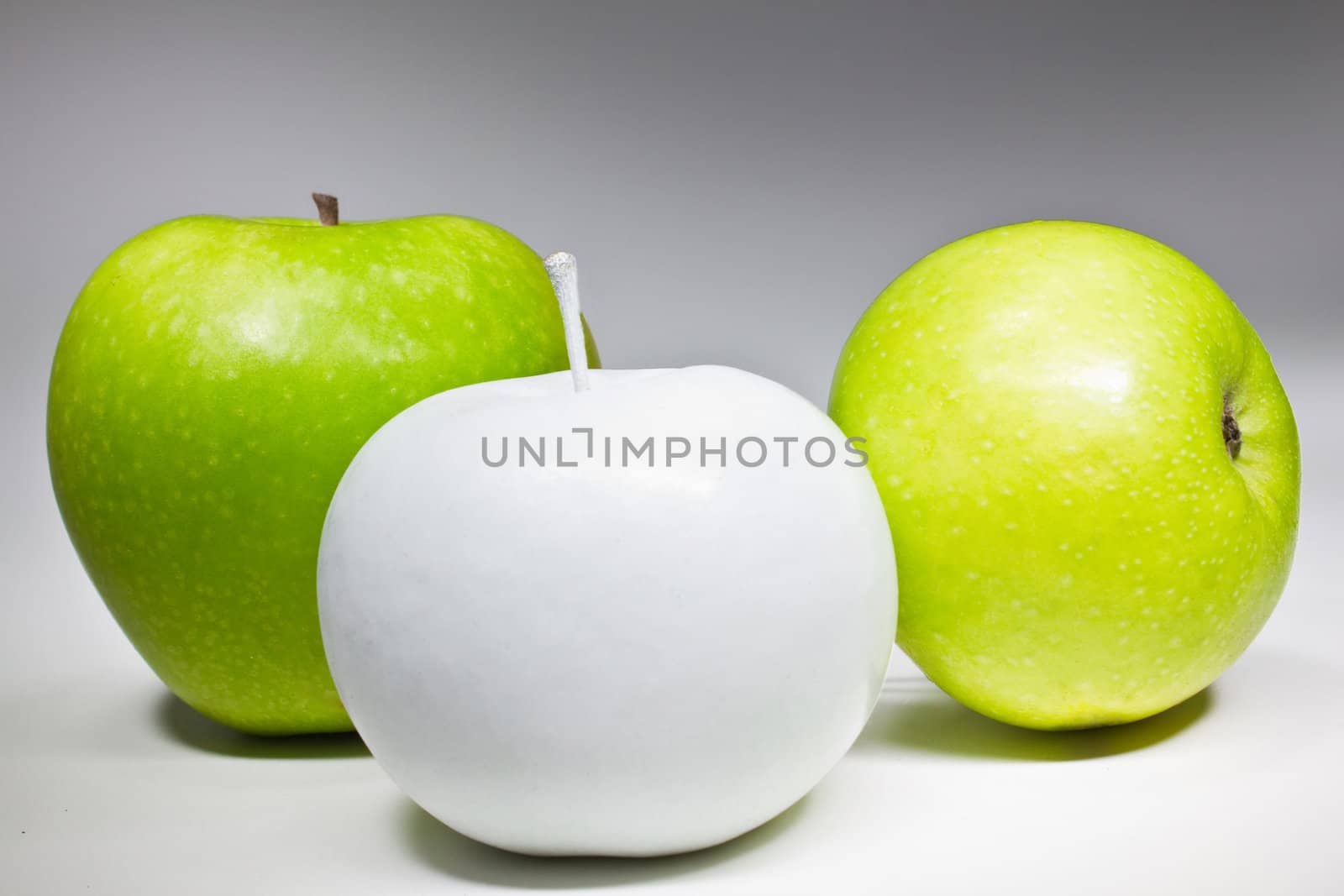 Green and white apples isolated on white