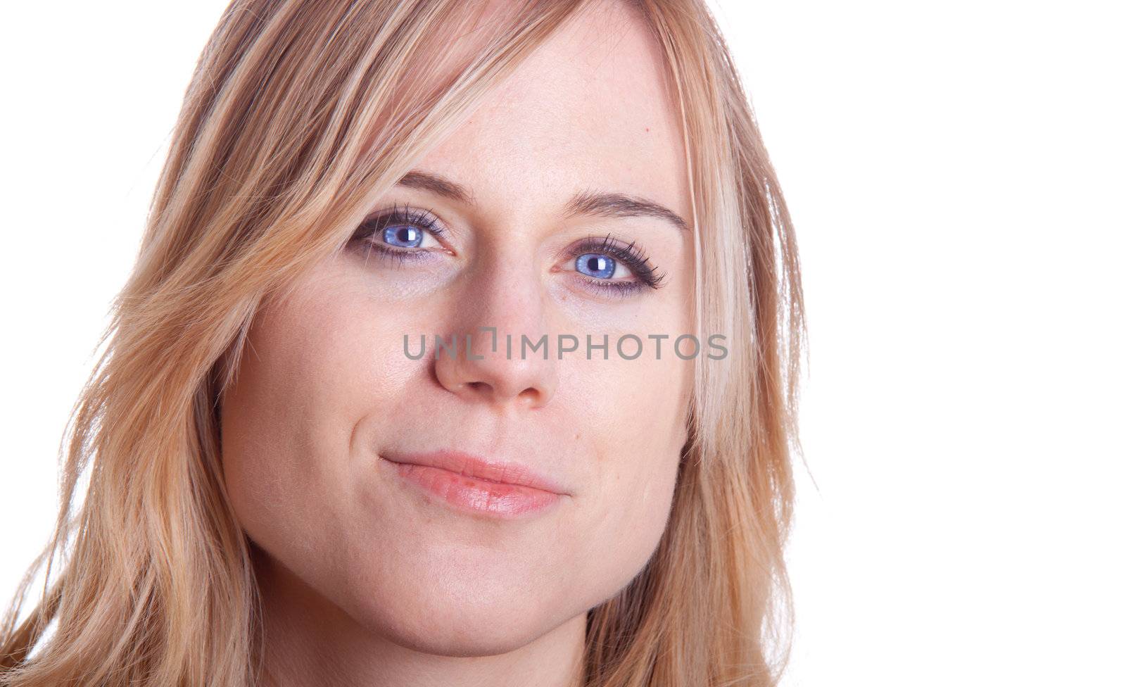 A woman looks into the camera with a slight smile.