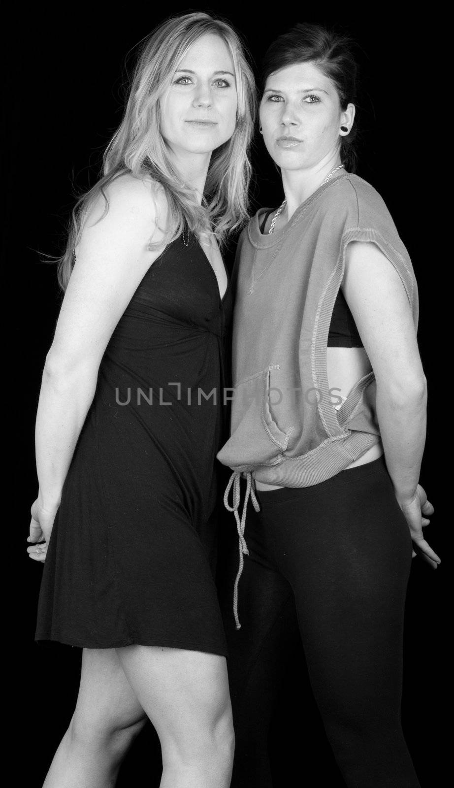 A nice black and white photograph of two attractive women.