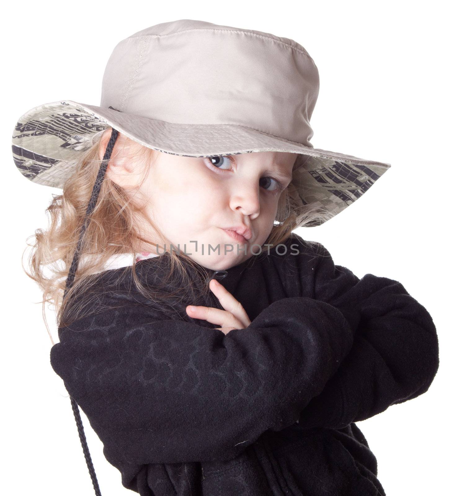 Photograph of a cute girl in a black shirt with an oversized hat.