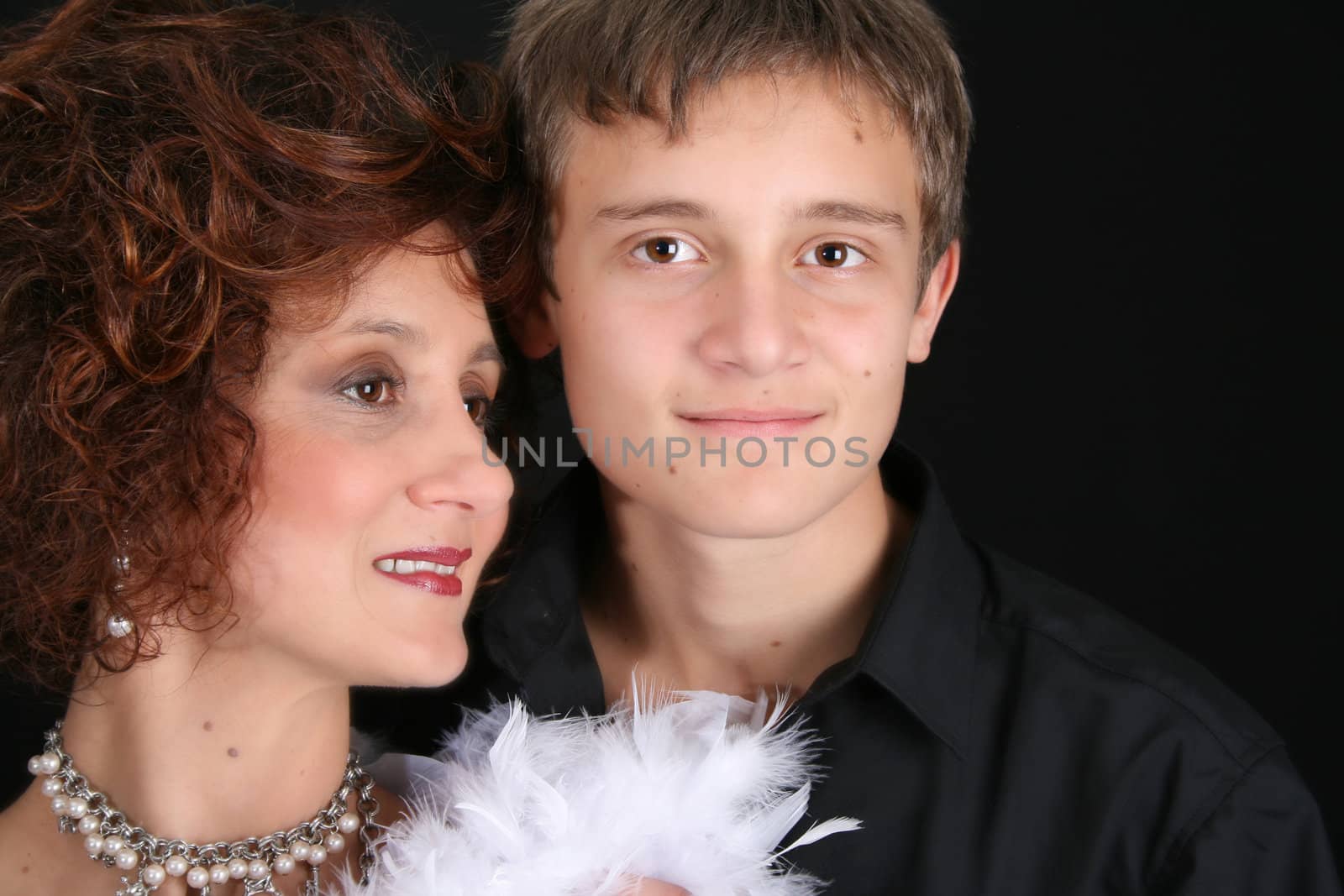 Rich and stylish mother and son in formal attire