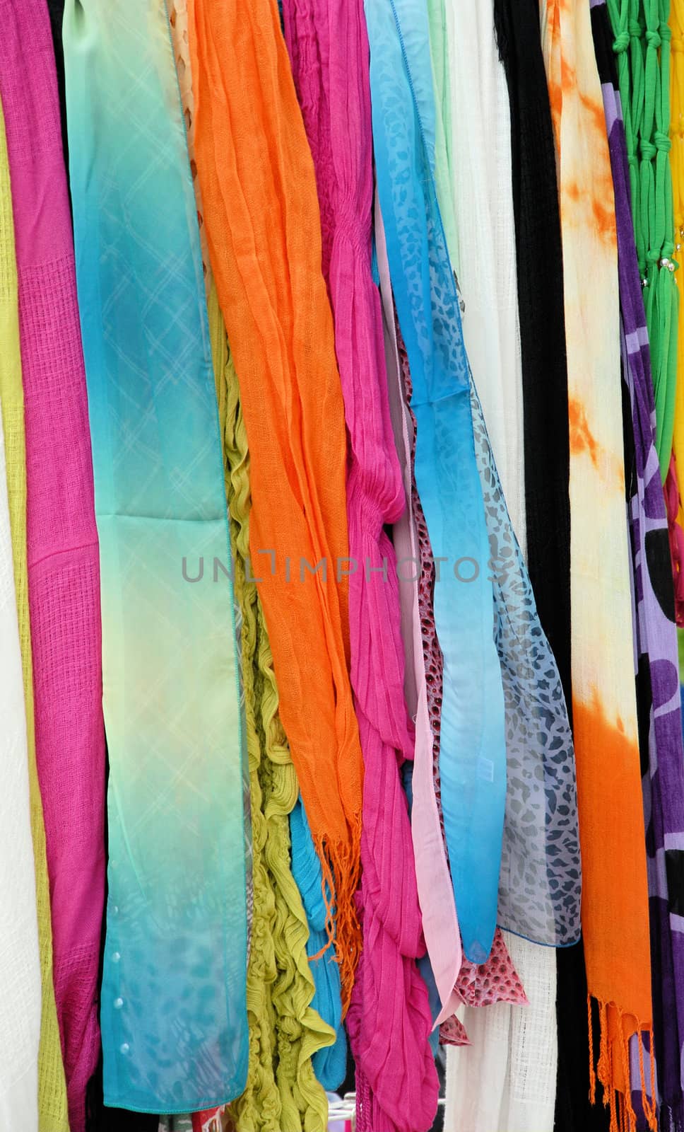 colorful scarfs for sale at a local street market