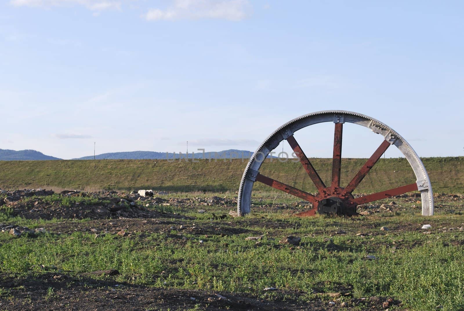 big red wheel on background of the landscape
