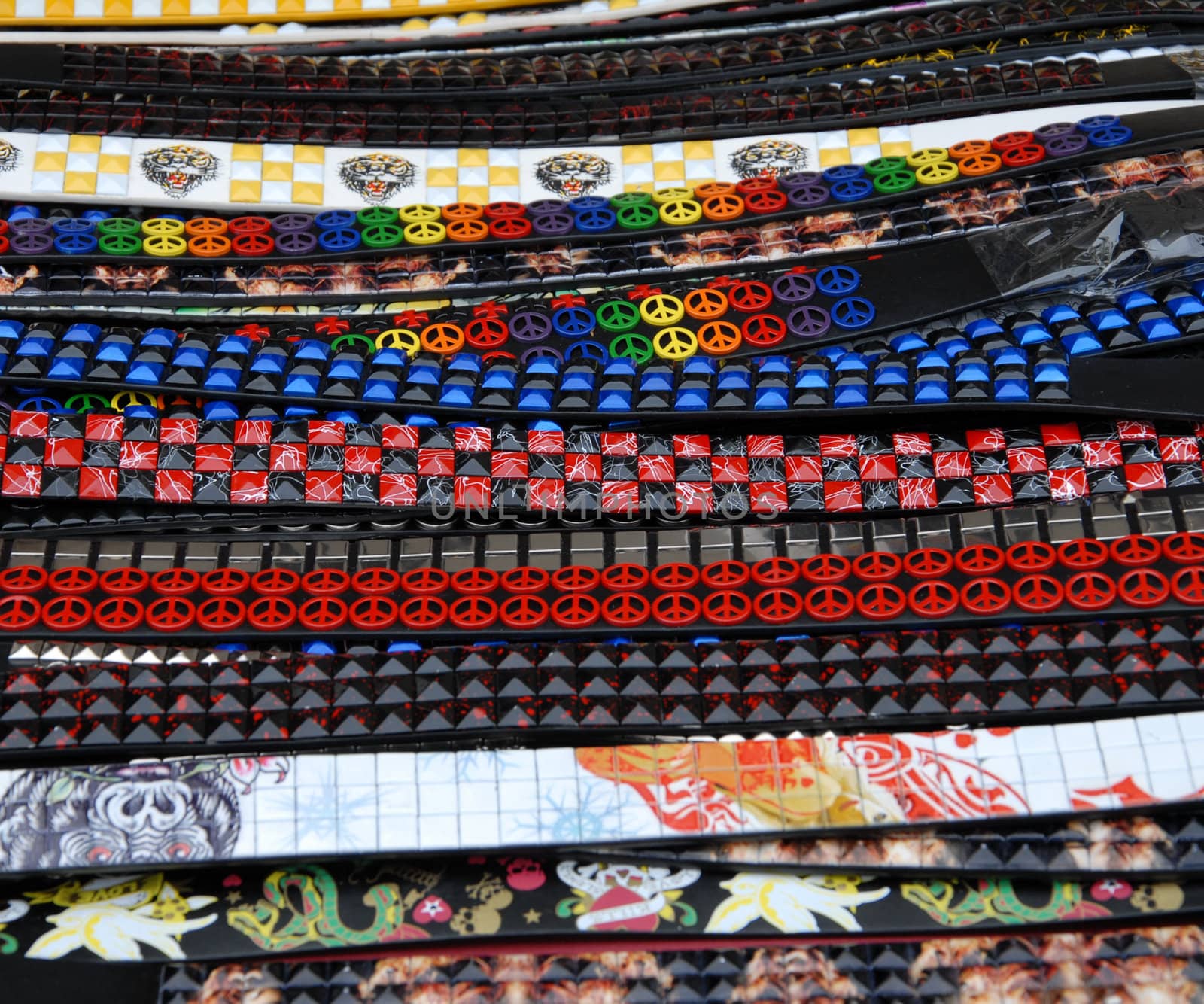 Colorful belts for sale at a street market