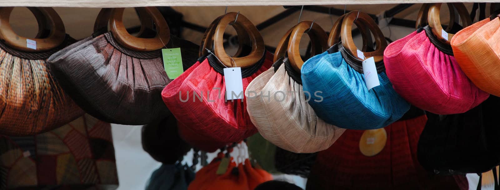 purses on sale at a street market