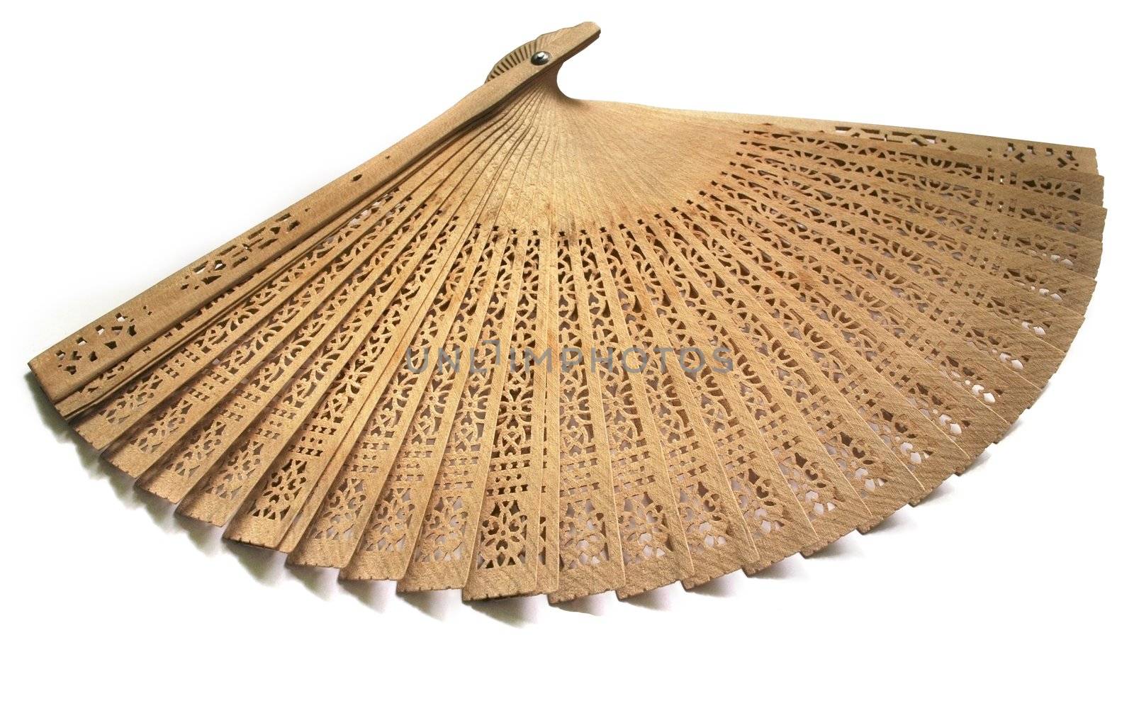 the carved wooden fan on the white background