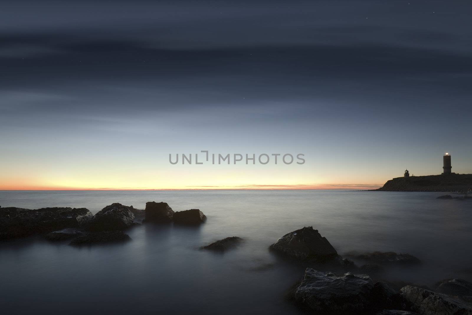 Seacoast. A decline. The sky in the light of the moon and the sun. Long exposure, a wide corner.