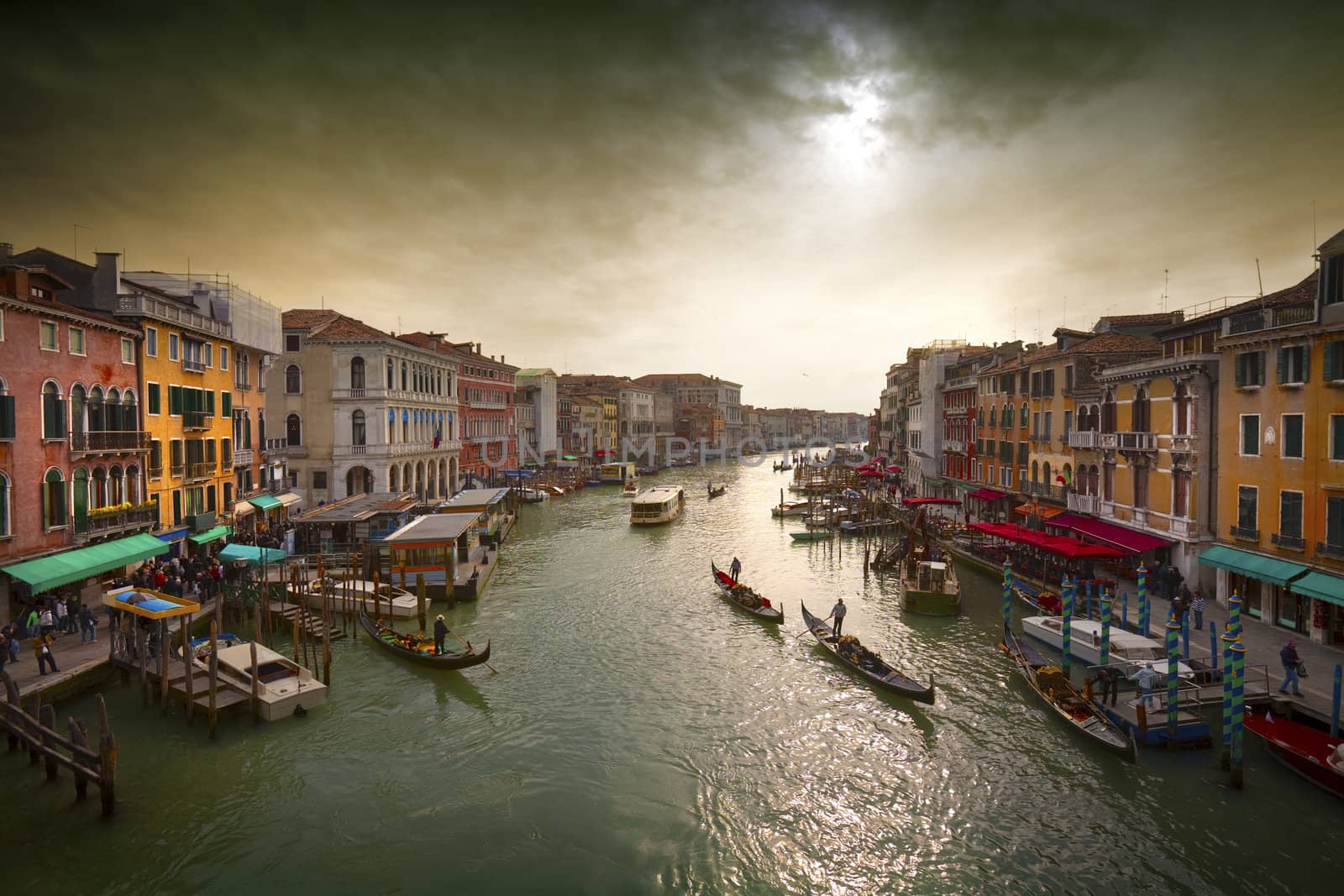 Boats and gondolas on the Grand Canal of Venice, Italy.