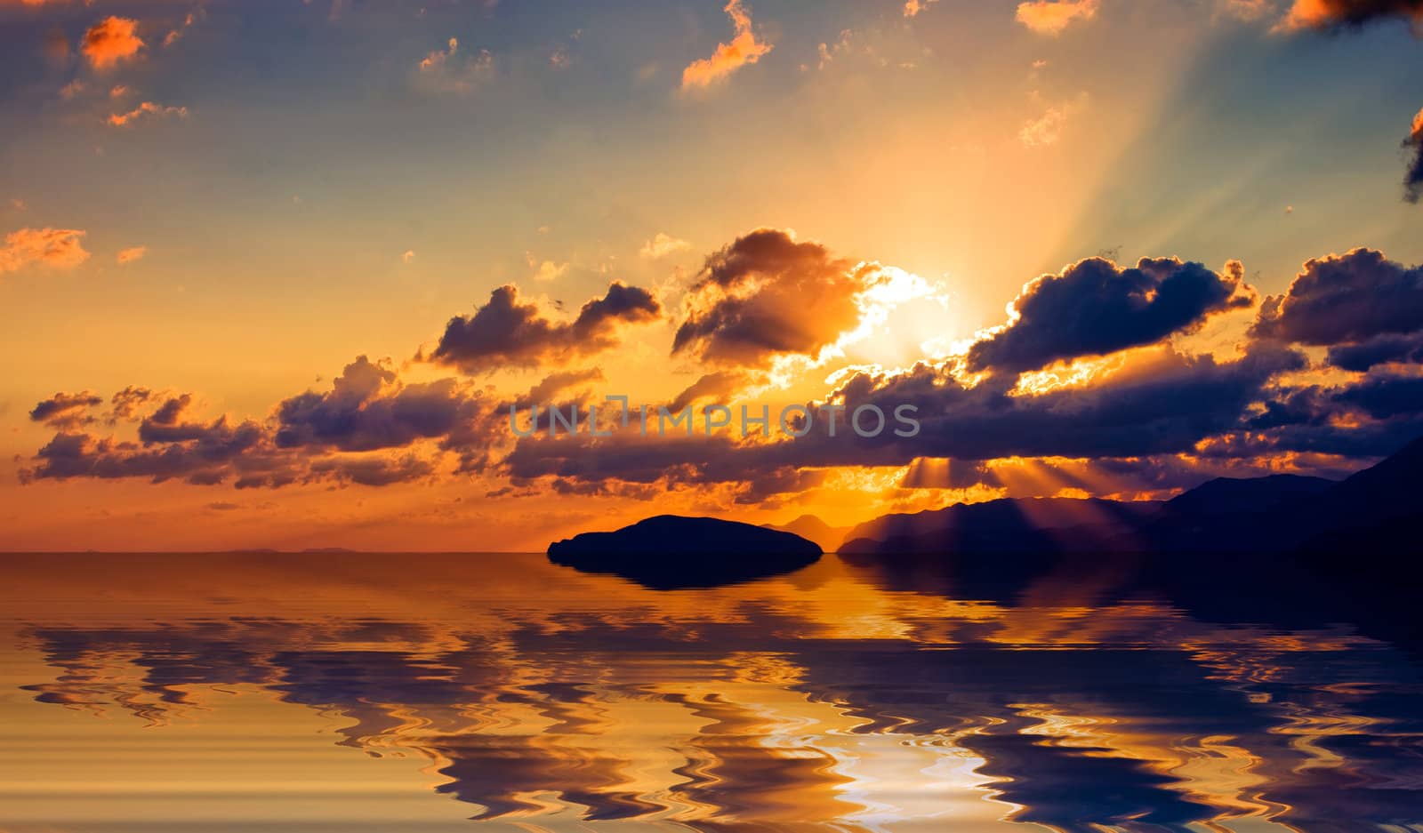 Sunrise over the Cretan land and the Mediterranean sea.