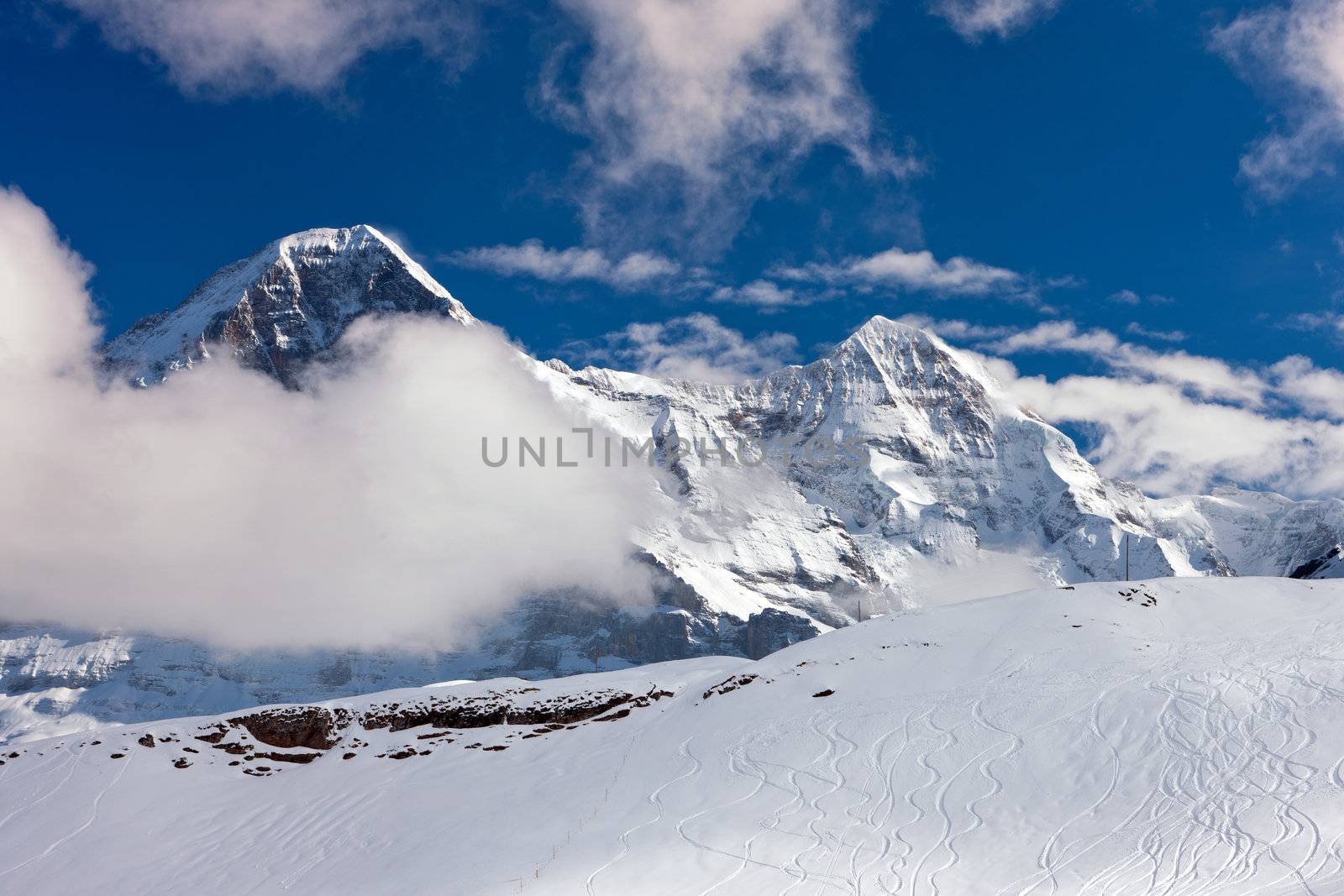 Ski slope in the background of Mount Eiger. The Eiger is a mountain in the Bernese Alps in Switzerland.