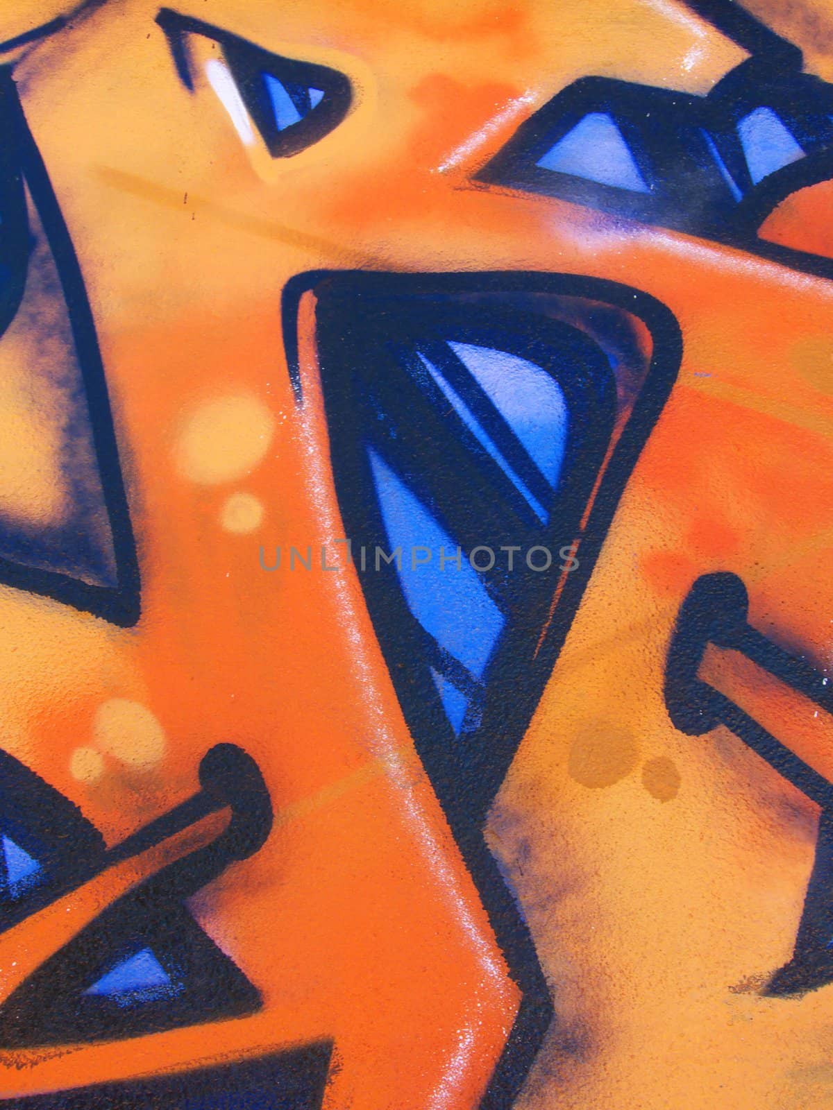 a close-up image of a blue and orange graffiti
