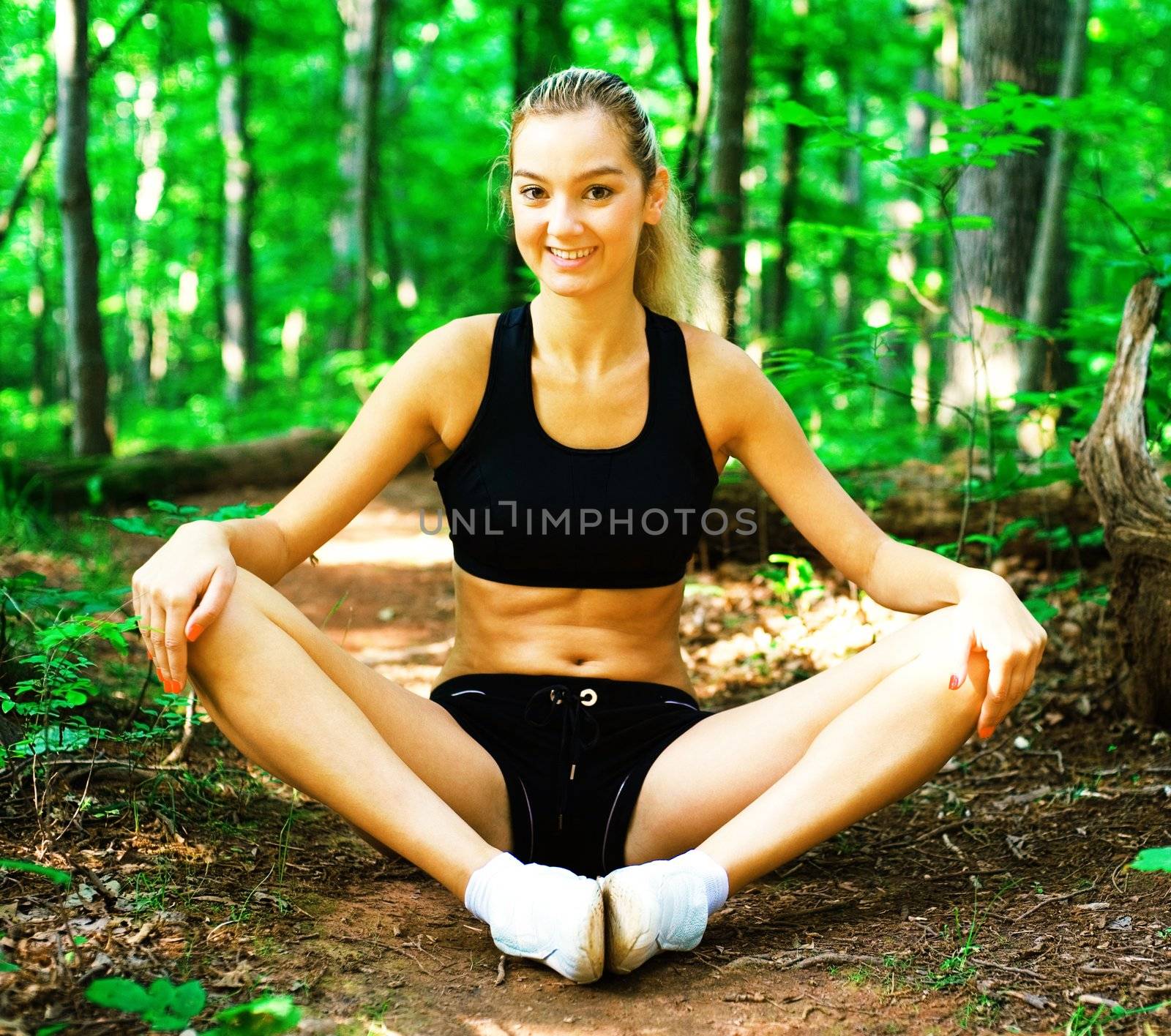 Blonde haired woman exercising, from a complete series of photos.