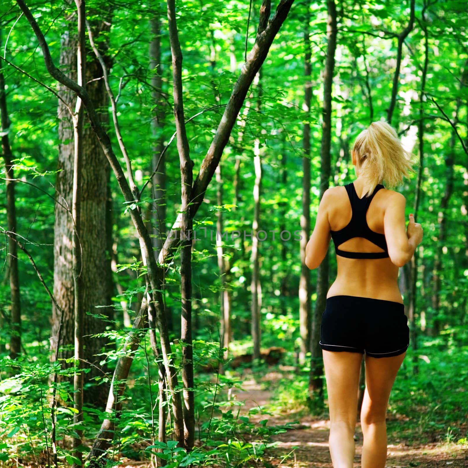 Blonde haired woman exercising, from a complete series of photos.