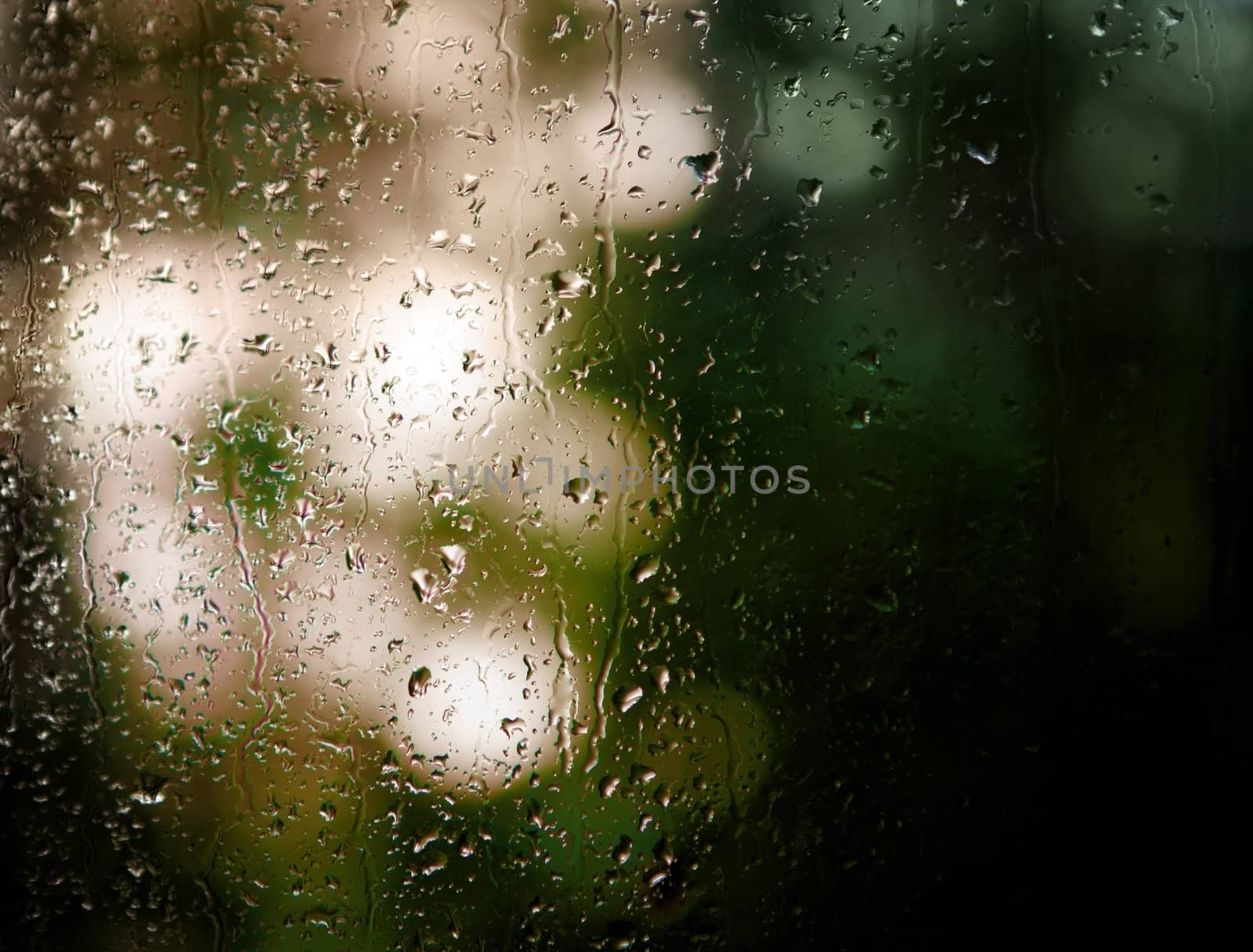 Background. Droplets and jets of water in bright light.