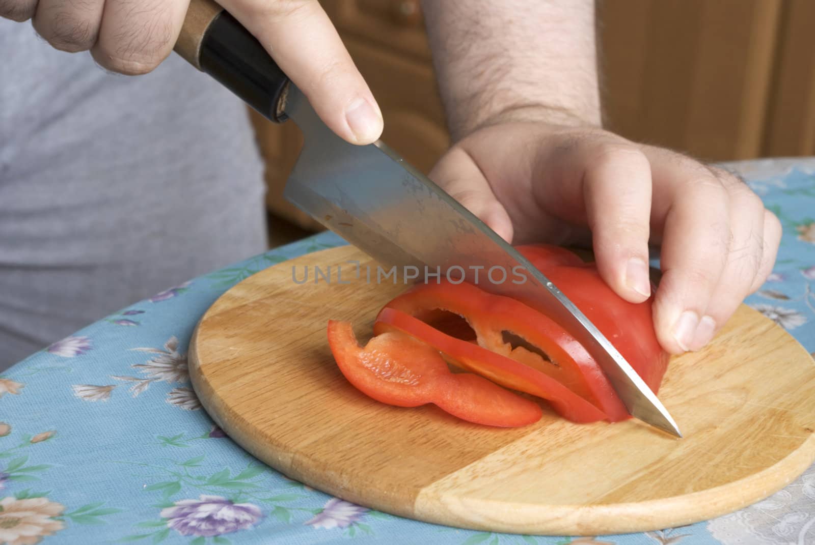 Cutting red sweet bulgarian pepper