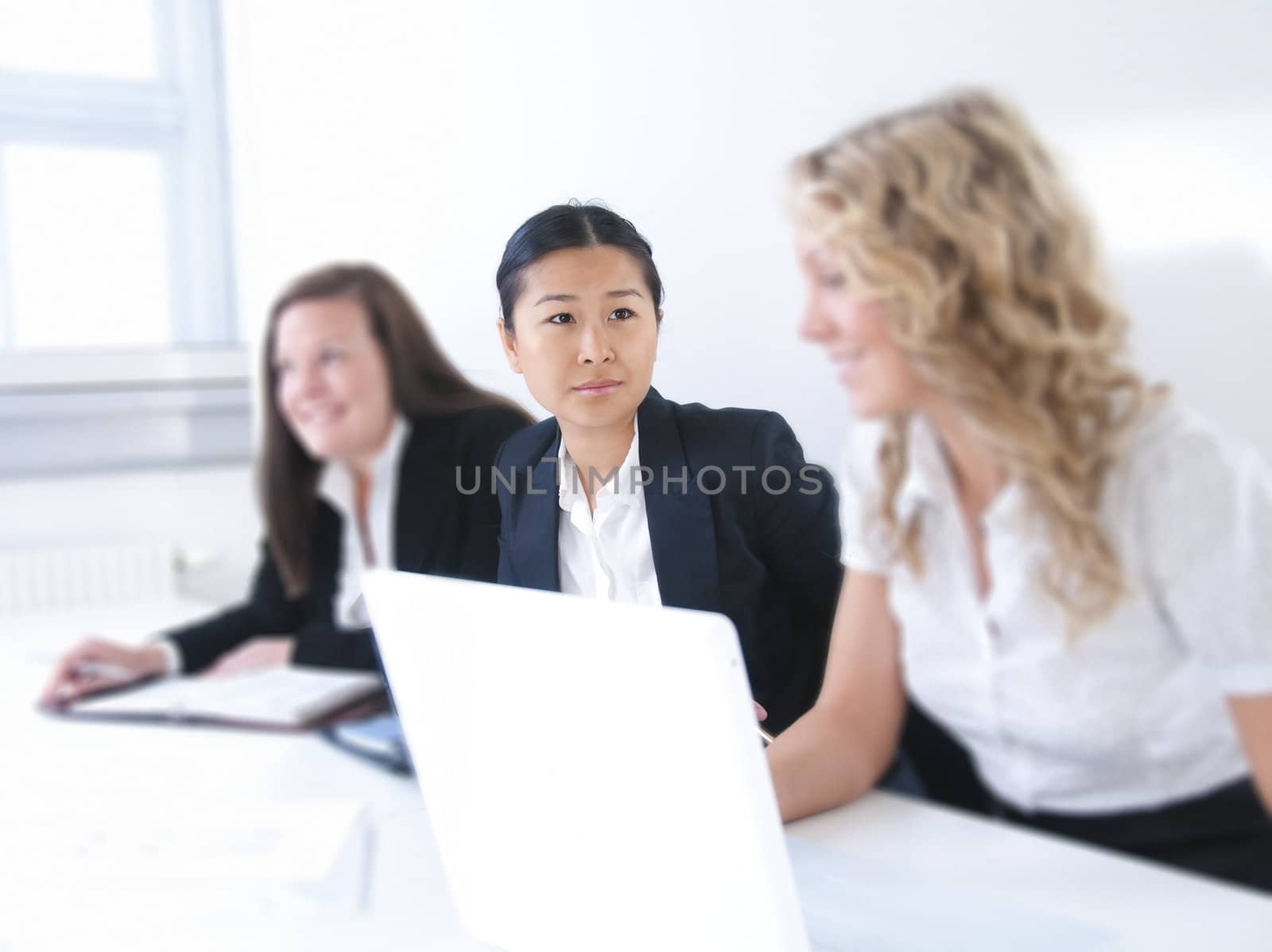 Group of business women at the office working