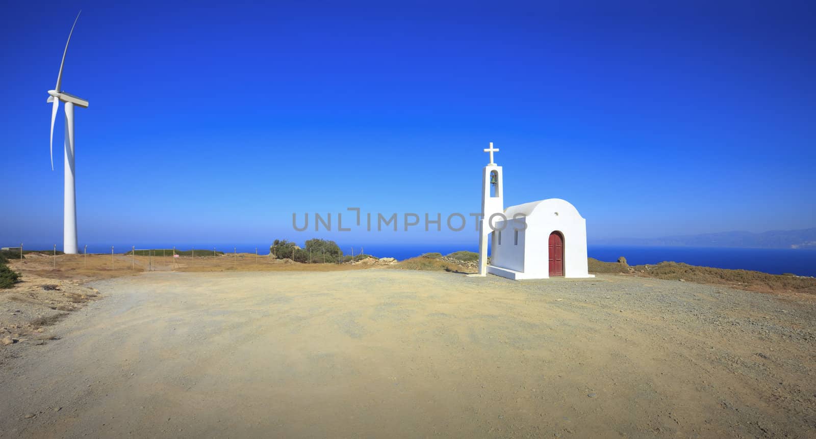 Mountain landscape. Chapel.Windmill. Crete. Greece.