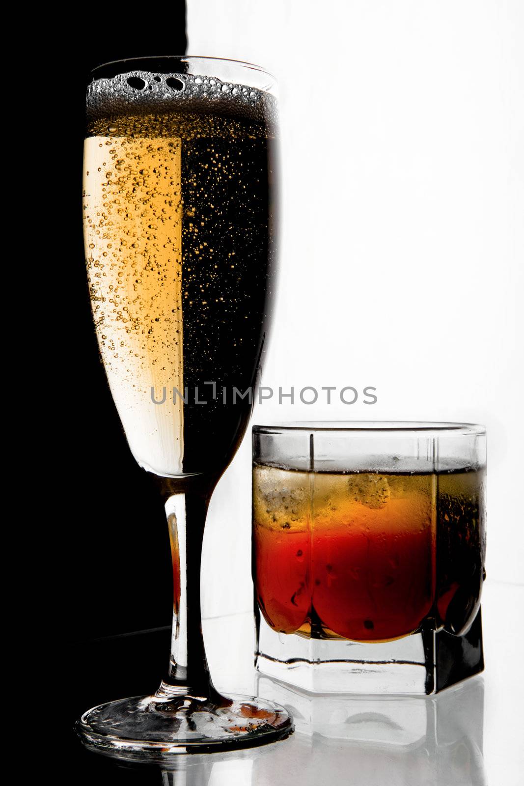 Glass of champagne and whisky with ice. by vladimir_sklyarov