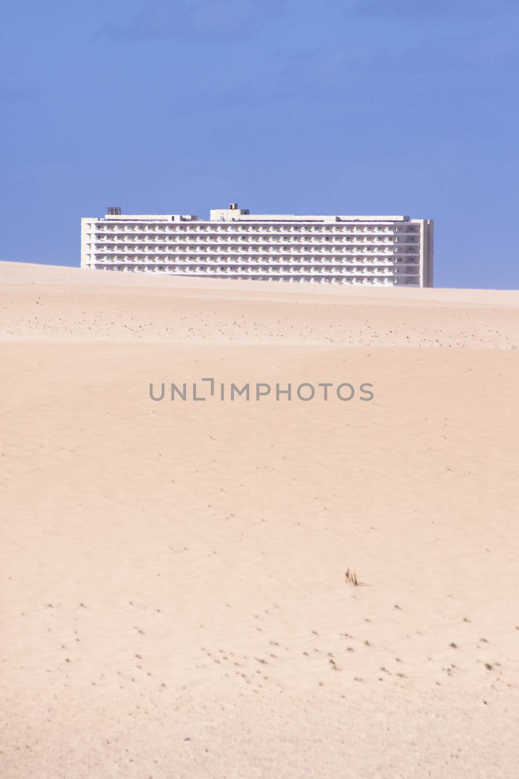Modern hotel in the midle of the sandy desert.