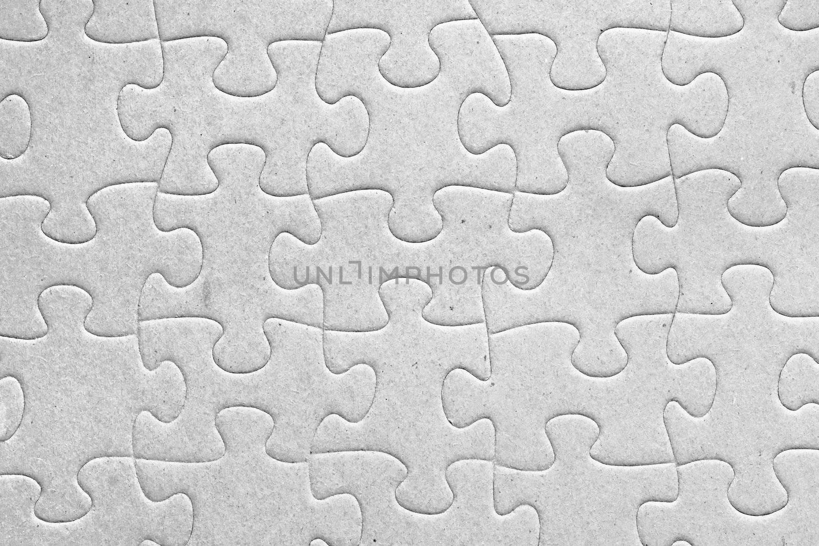 Unity:blank grey jigsaw puzzle pieces all connected, great details of textured cardboard material